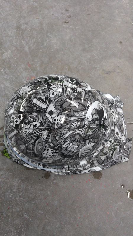 A black and white photo of a pile of junk on the ground.