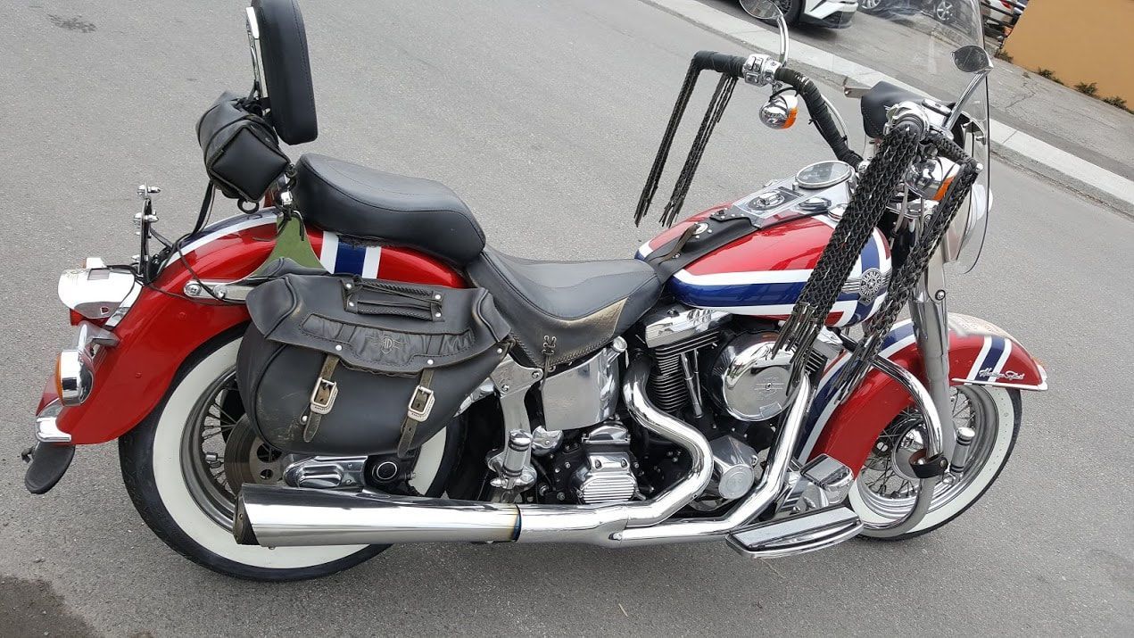A harley davidson motorcycle is parked on the side of the road