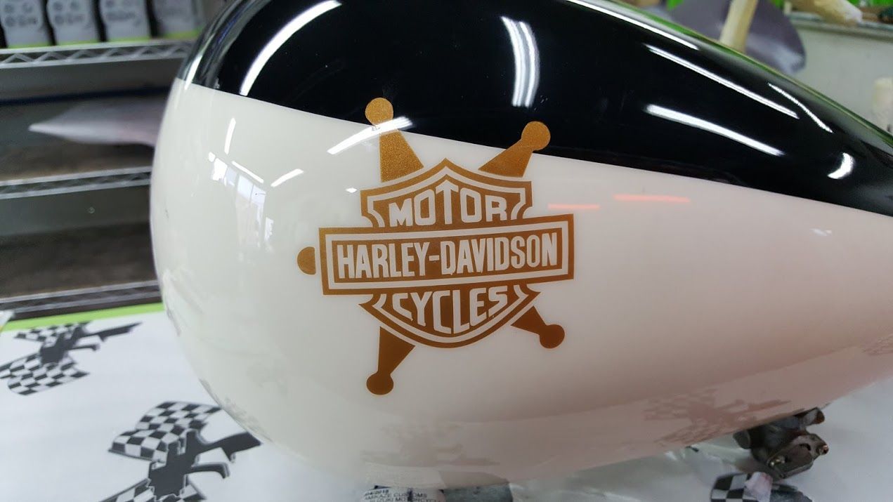 A black and white harley davidson motorcycle tank