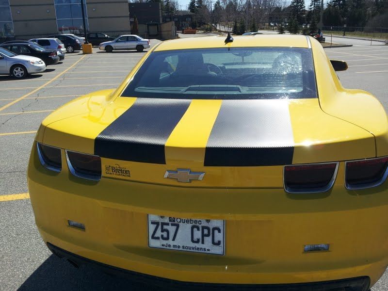 A yellow car with a license plate that says 257 cpc