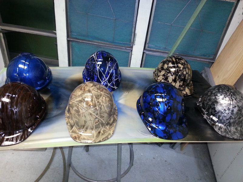 A bunch of hard hats are sitting on a table