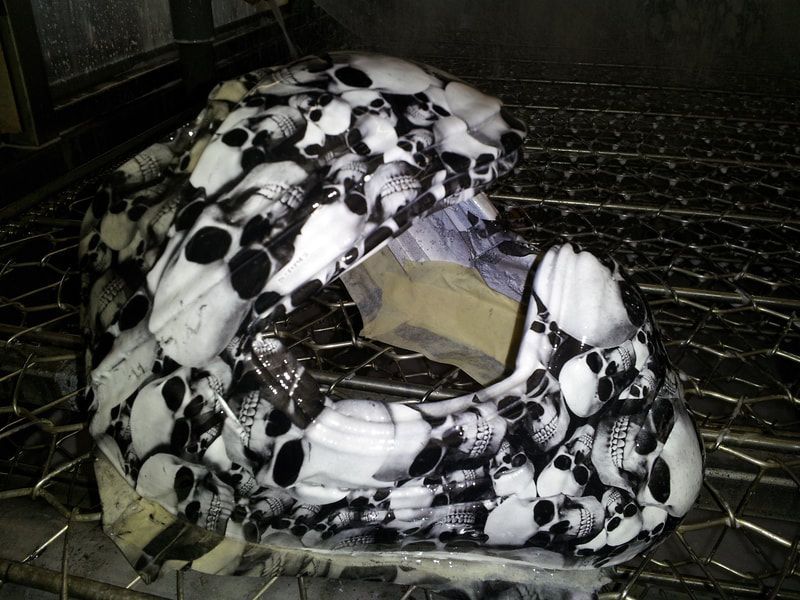 A helmet with black and white skulls on it