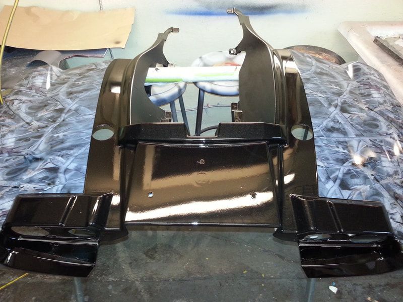 A piece of black plastic is sitting on a table