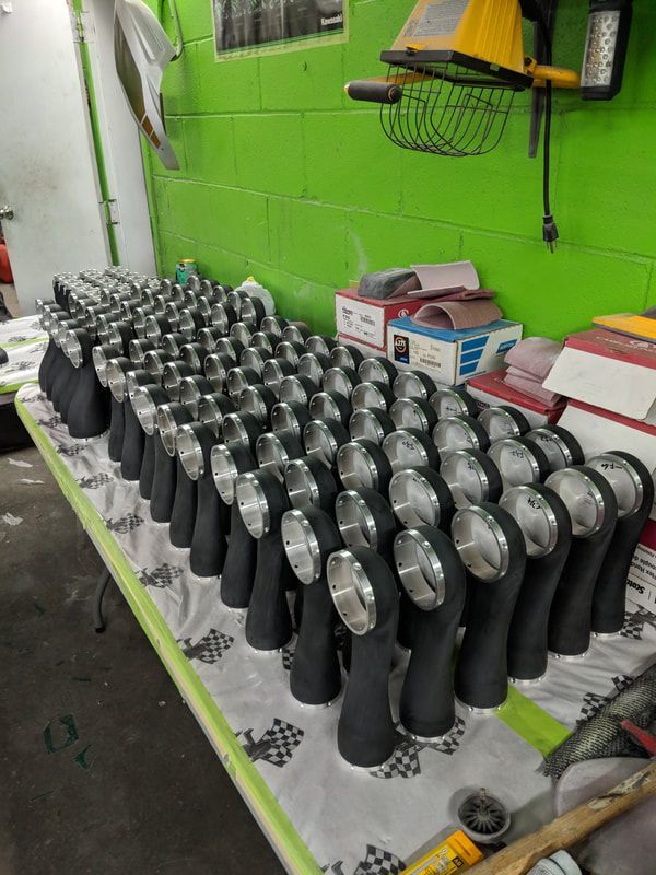 A table with a lot of black objects on it