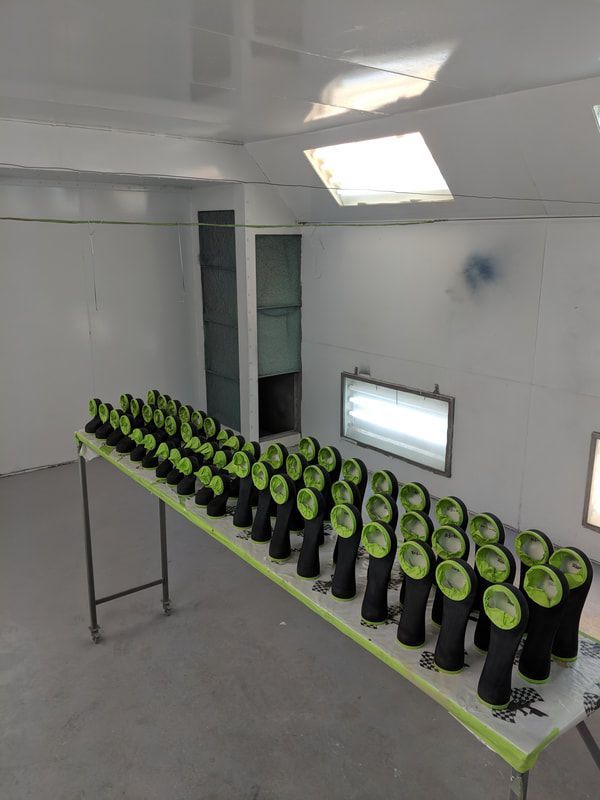 A table with a lot of green objects on it