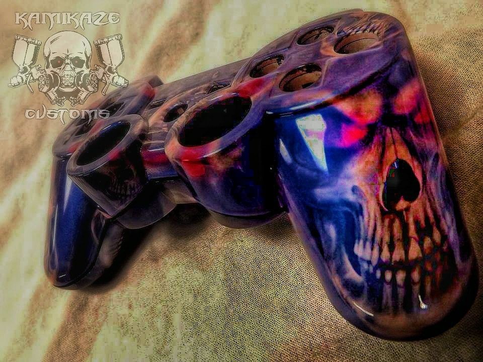 A video game controller with a skull painted on it