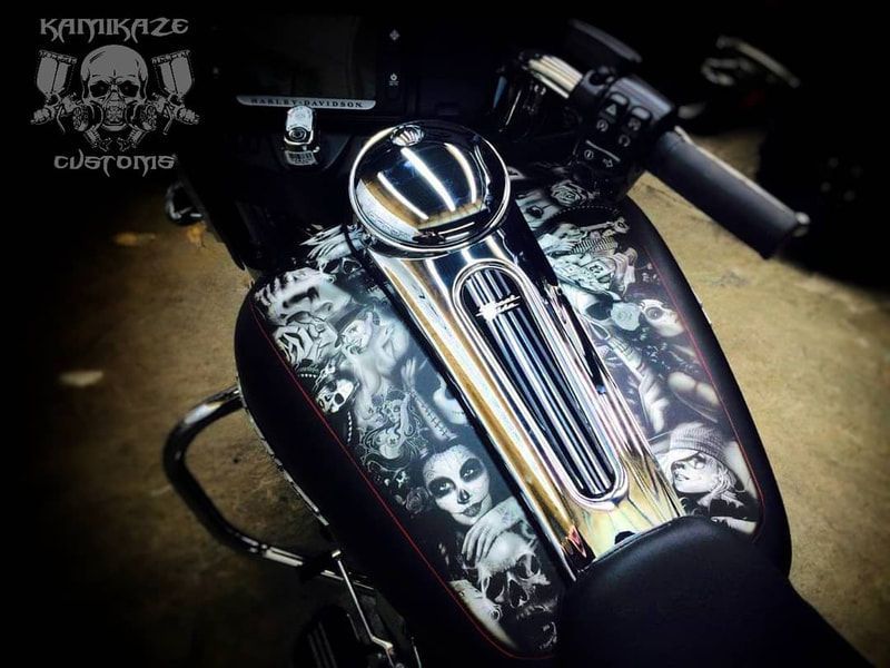 A close up of a motorcycle with the words kamukaze customs on the bottom