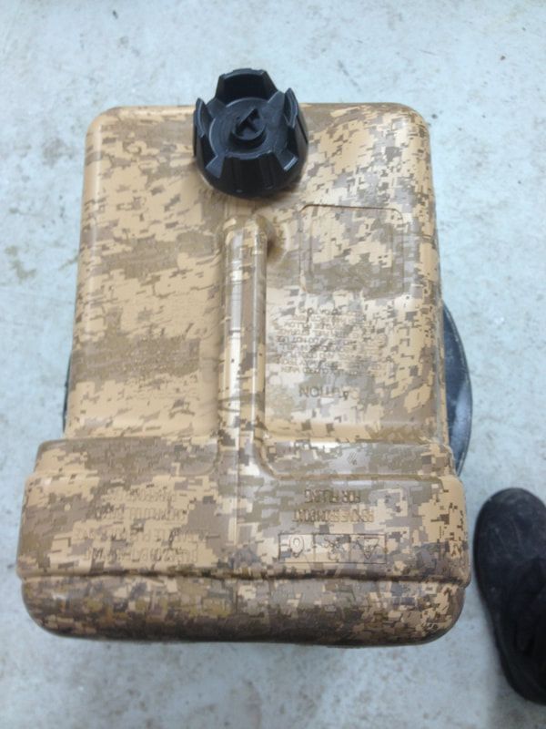 A brown container with a black cap on top of it