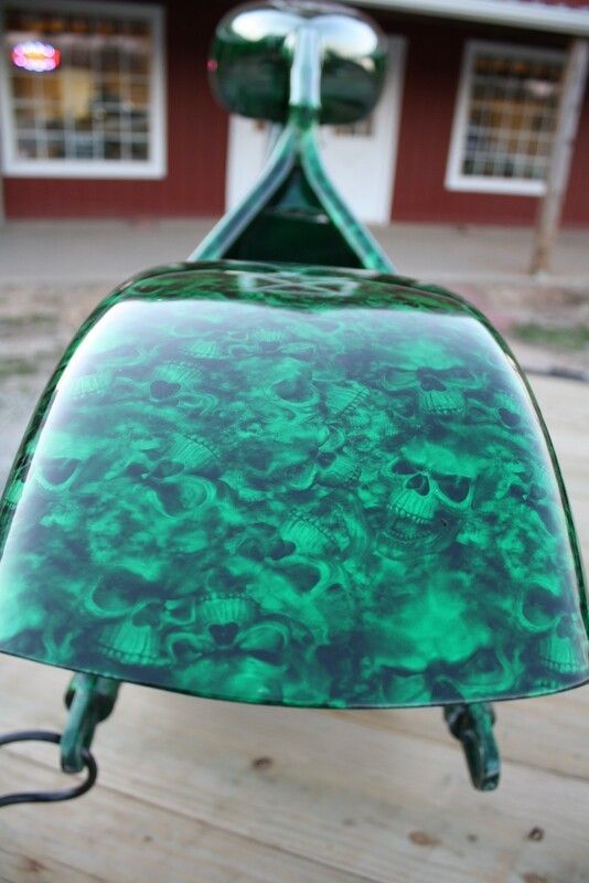A green object with skulls painted on it