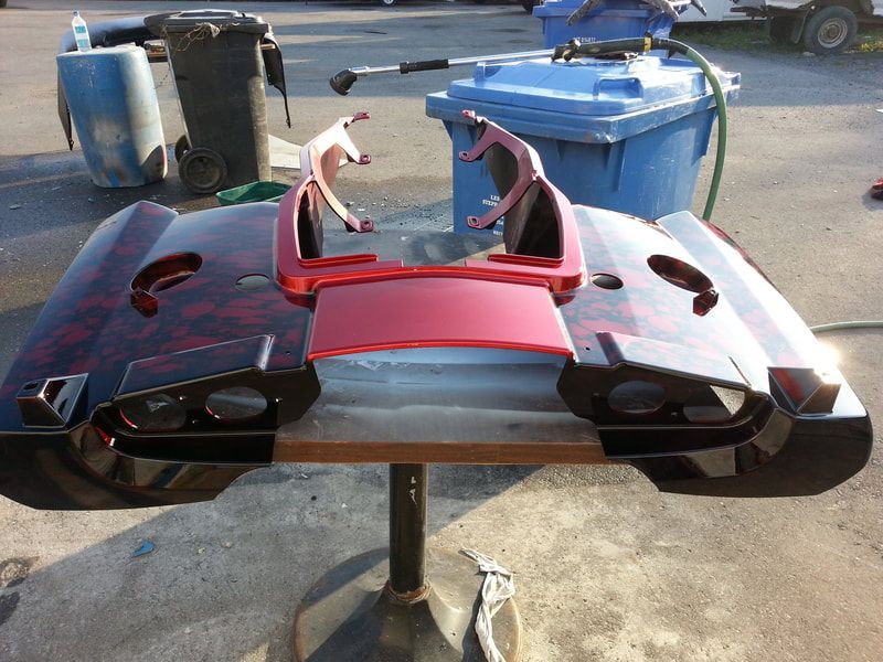 A table with a red and black item on it