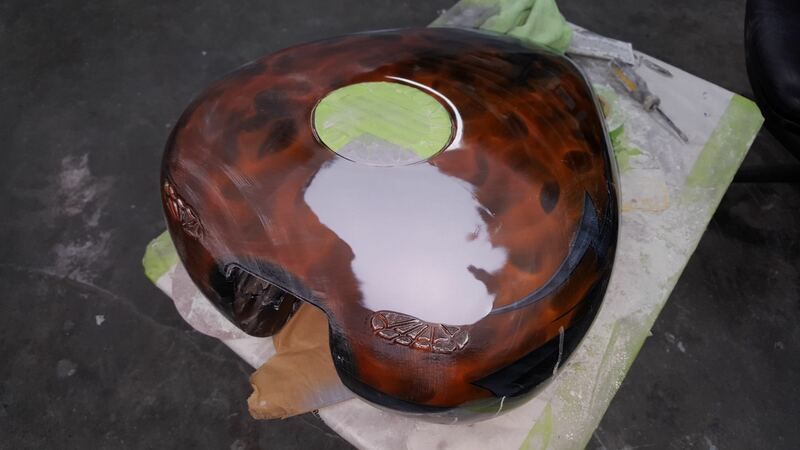 A piece of wood with a hole in the middle is sitting on a table.