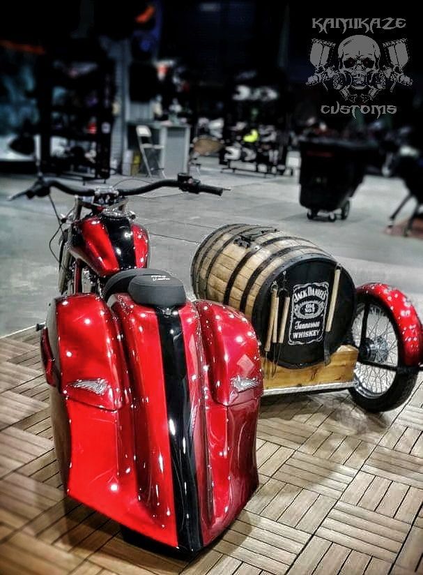 A red motorcycle with a sidecar attached to it