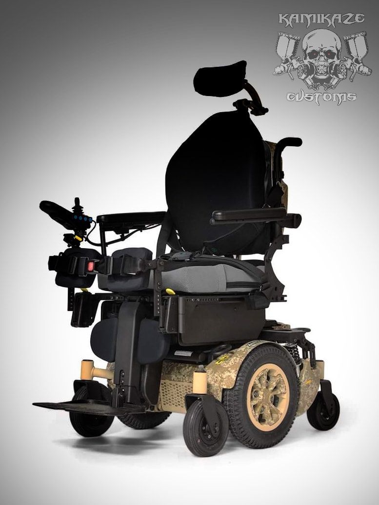A black and gold wheelchair with a skull in the background