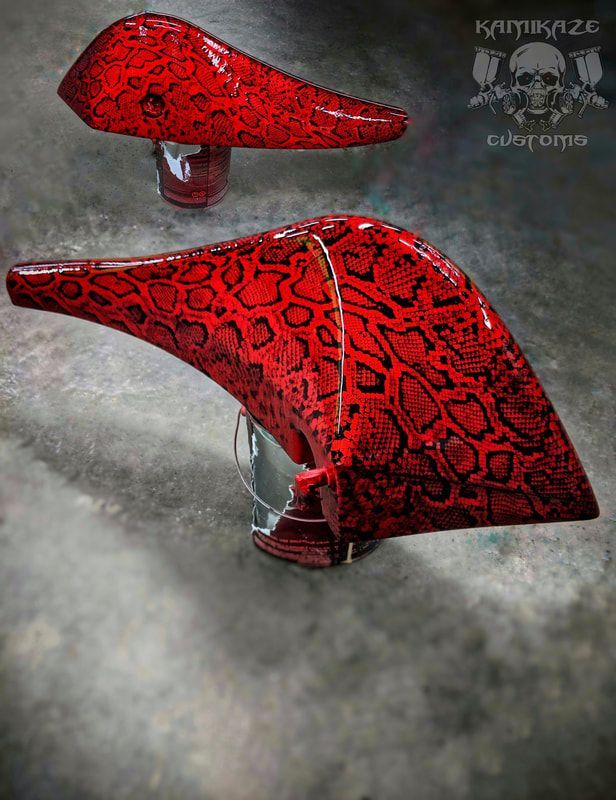 A pair of red shoes are sitting on a concrete surface.