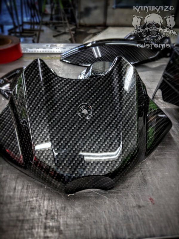 A piece of carbon fiber is sitting on a table.