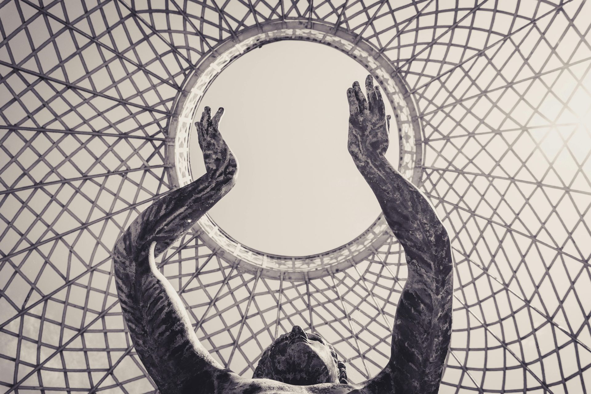 Woman's arms painted and raised to the sky
