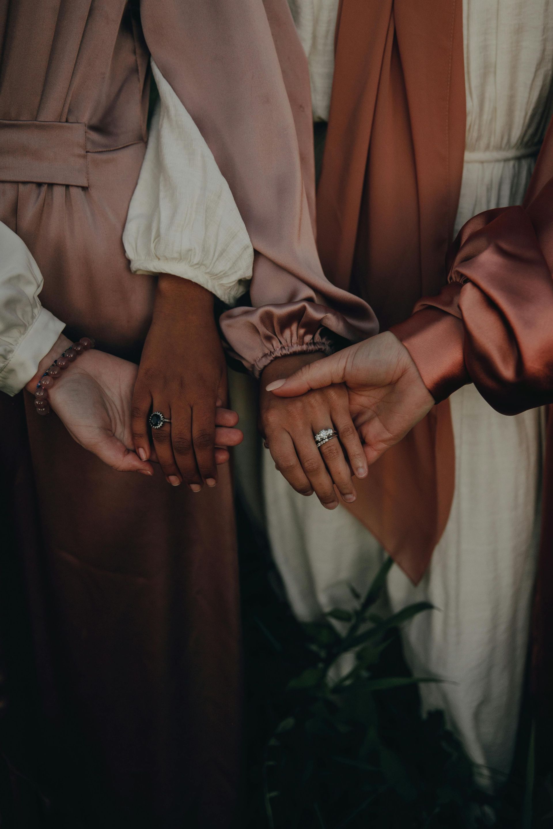 Women holding hands
