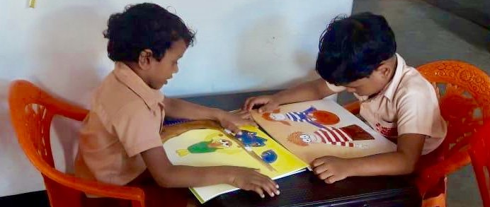 Reading our books in Sri Lanka