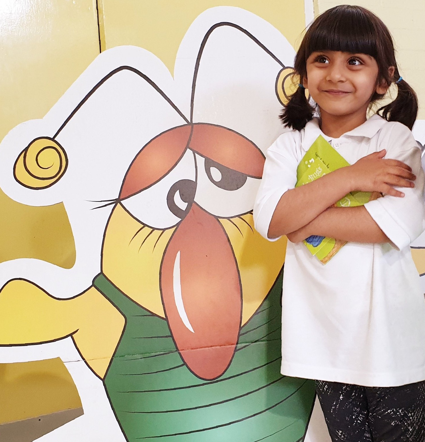 Girl with fitness bug cutout and book