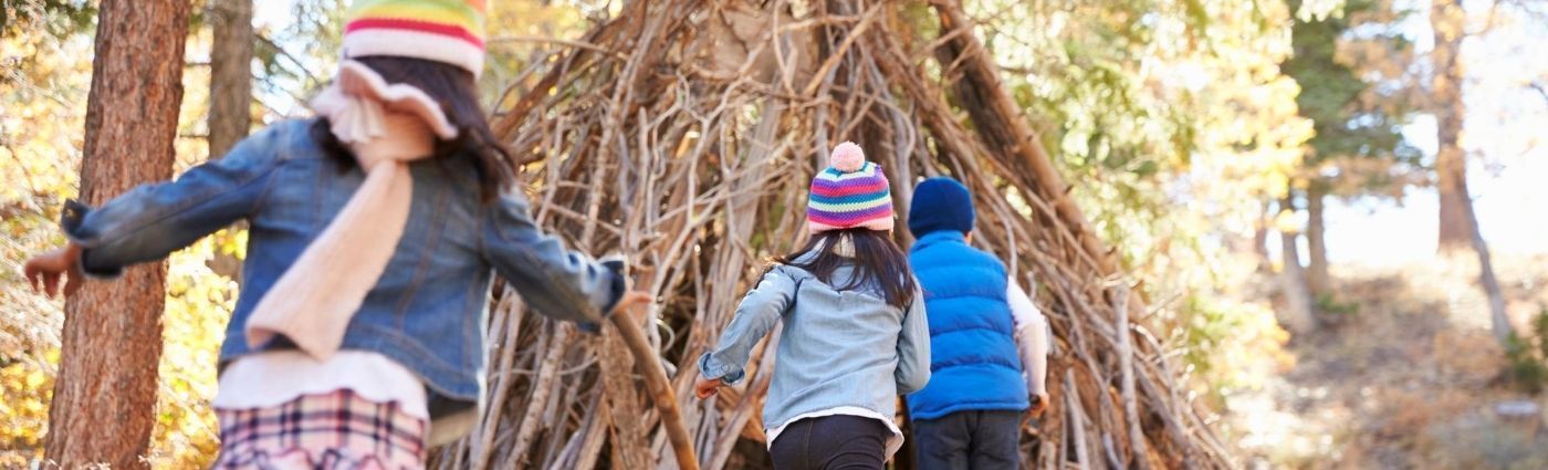 kids playing in a homemade den