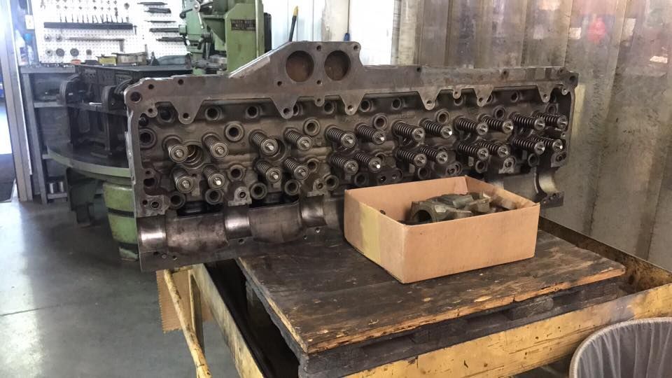 A Cylinder Head Is Sitting On Top Of A Wooden Table | Sedley, VA | Felts Machine, Inc.