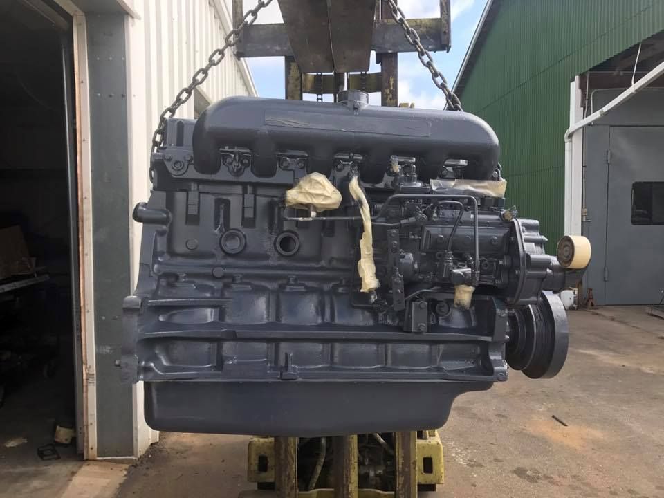 A Large Engine Is Being Lifted By A Crane | Sedley, VA | Felts Machine, Inc.