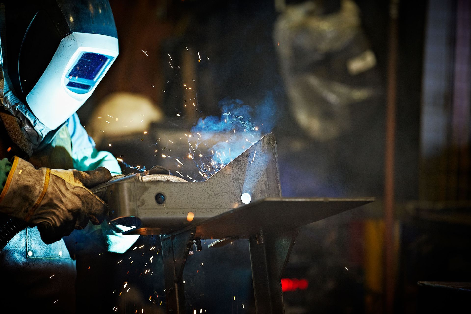 A Man Welding A Piece Of Metal | Sedley, VA | Felts Machine, Inc.