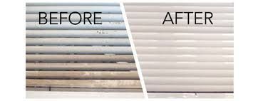 Before and after cleaning of a window blind.