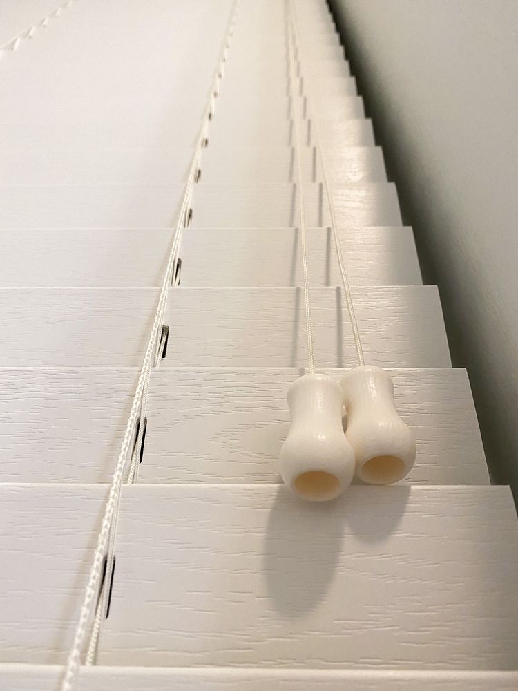 White pleated window blinds.