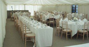 Wedding breakfast with cream tables and chairs