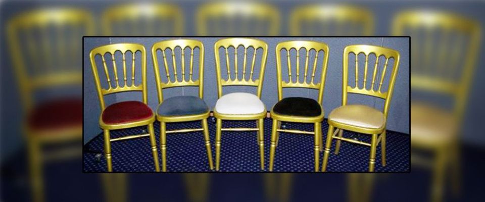 Gold chairs with different coloured cushions