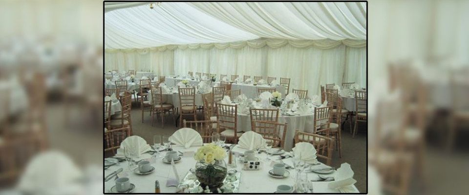 Wedding breakfast with wooden chairs and tables