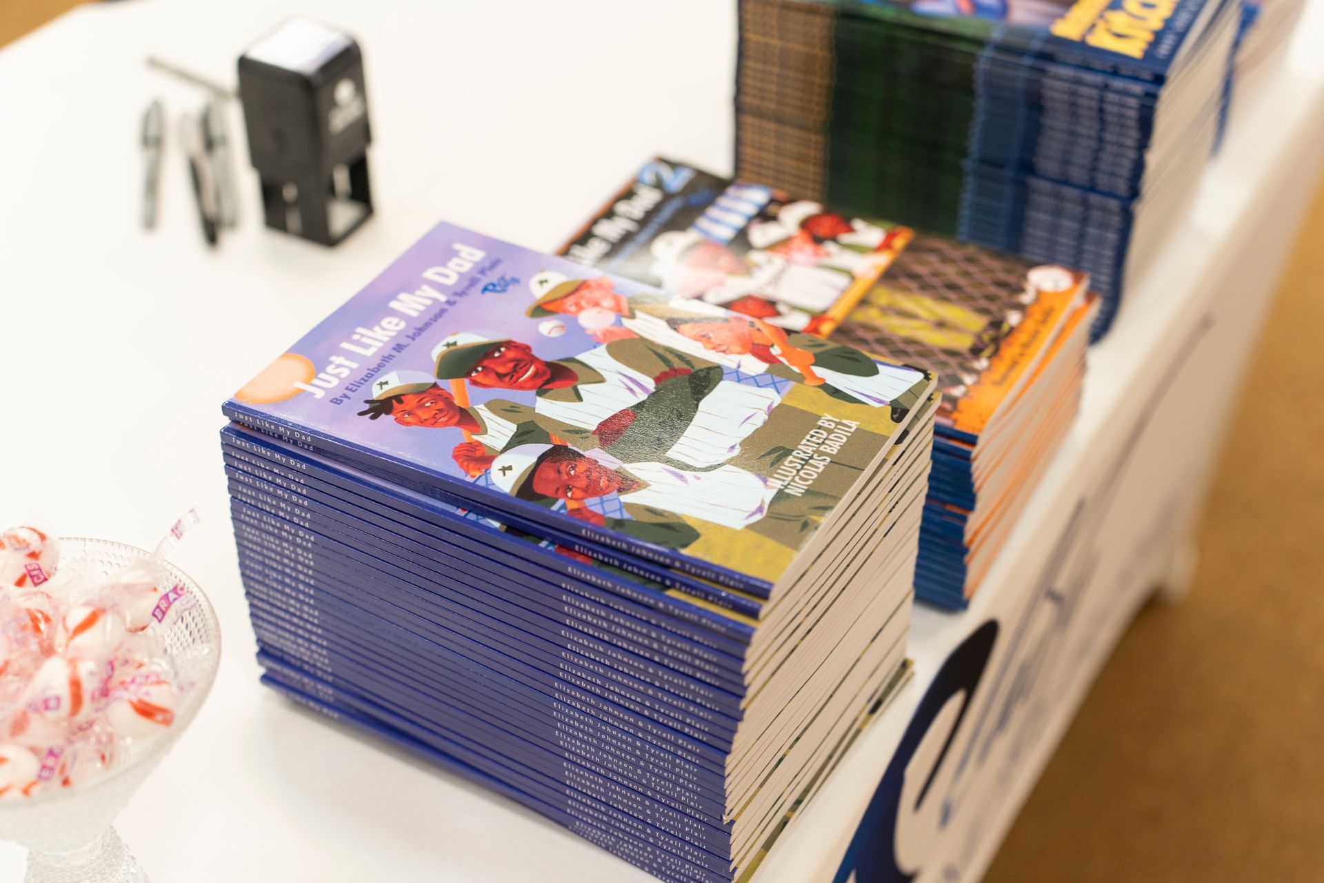 A stack of books sitting on top of each other on a table.