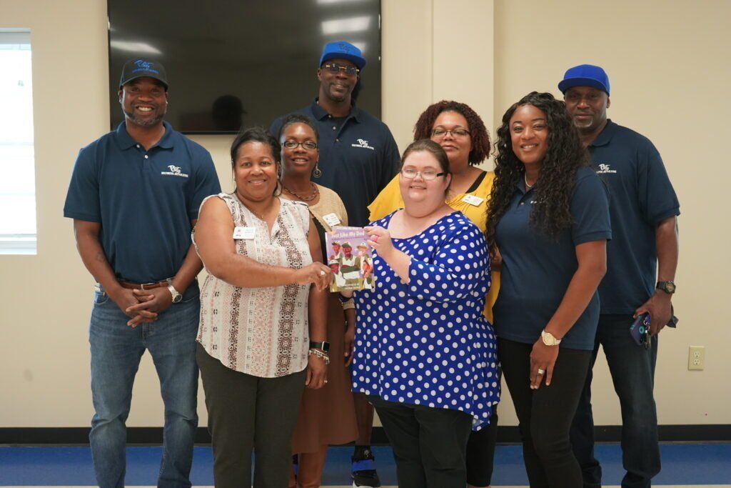 A group of people are posing for a picture in a room