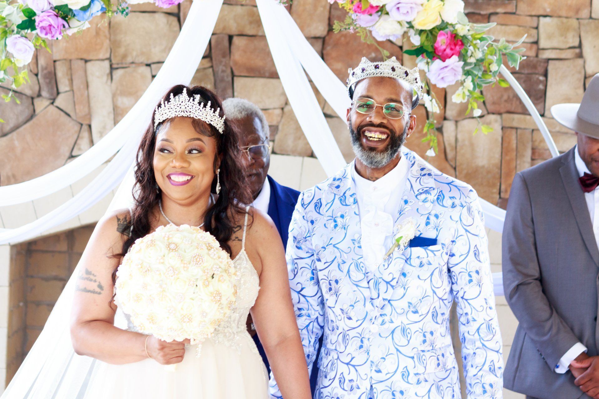 A bride and groom are walking down the aisle at their wedding.