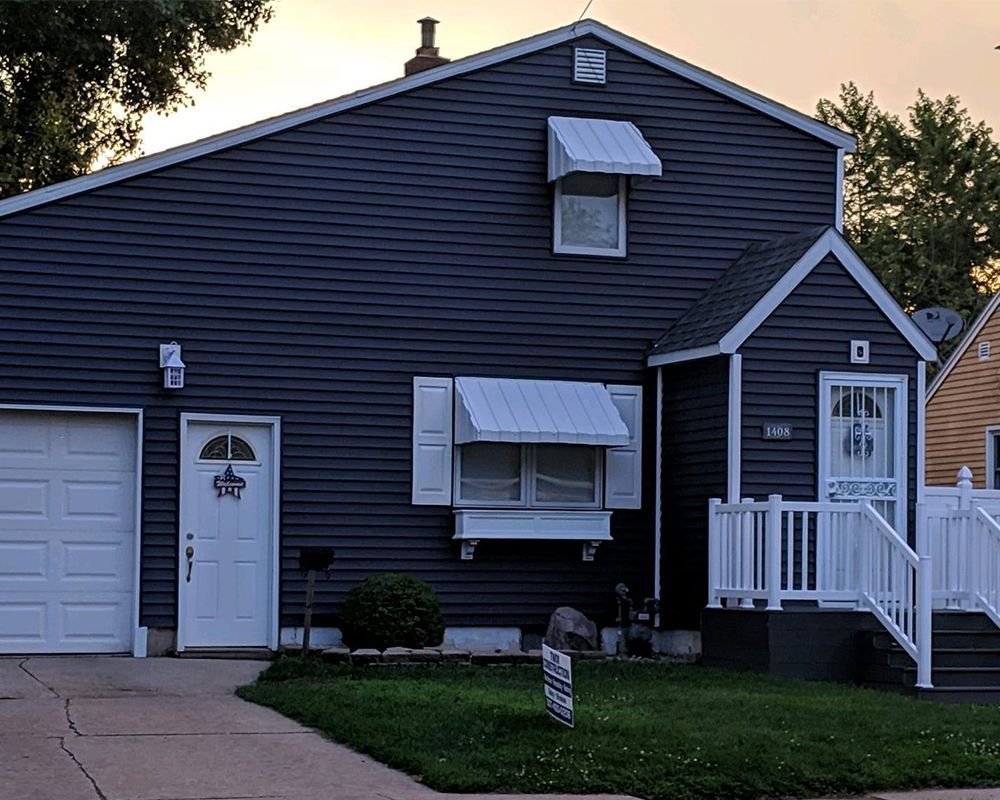 House with Dark Blue Sidings — Austin, MN — Twix Construction