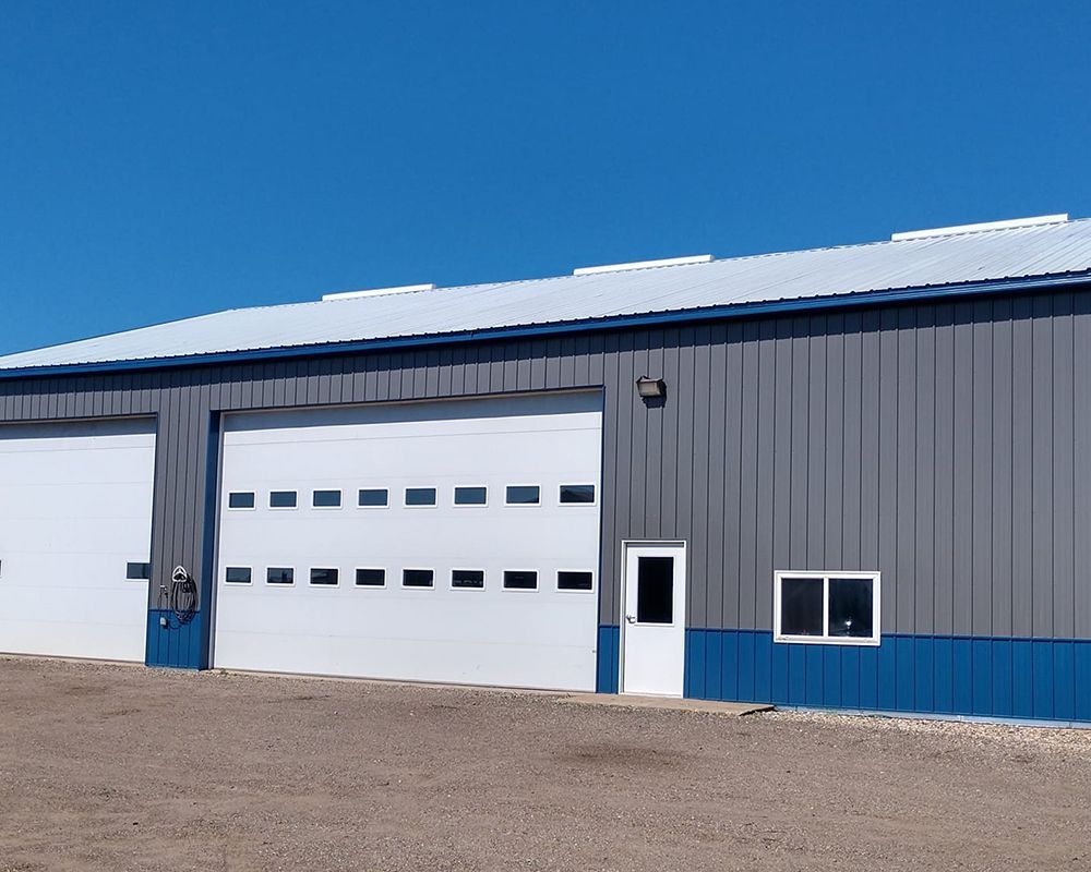 Warehouse with Blue and Dark Gray Sidings — Austin, MN — Twix Construction
