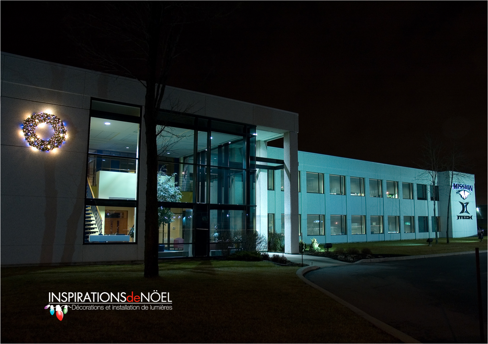 A large white building with a wreath on the front of it