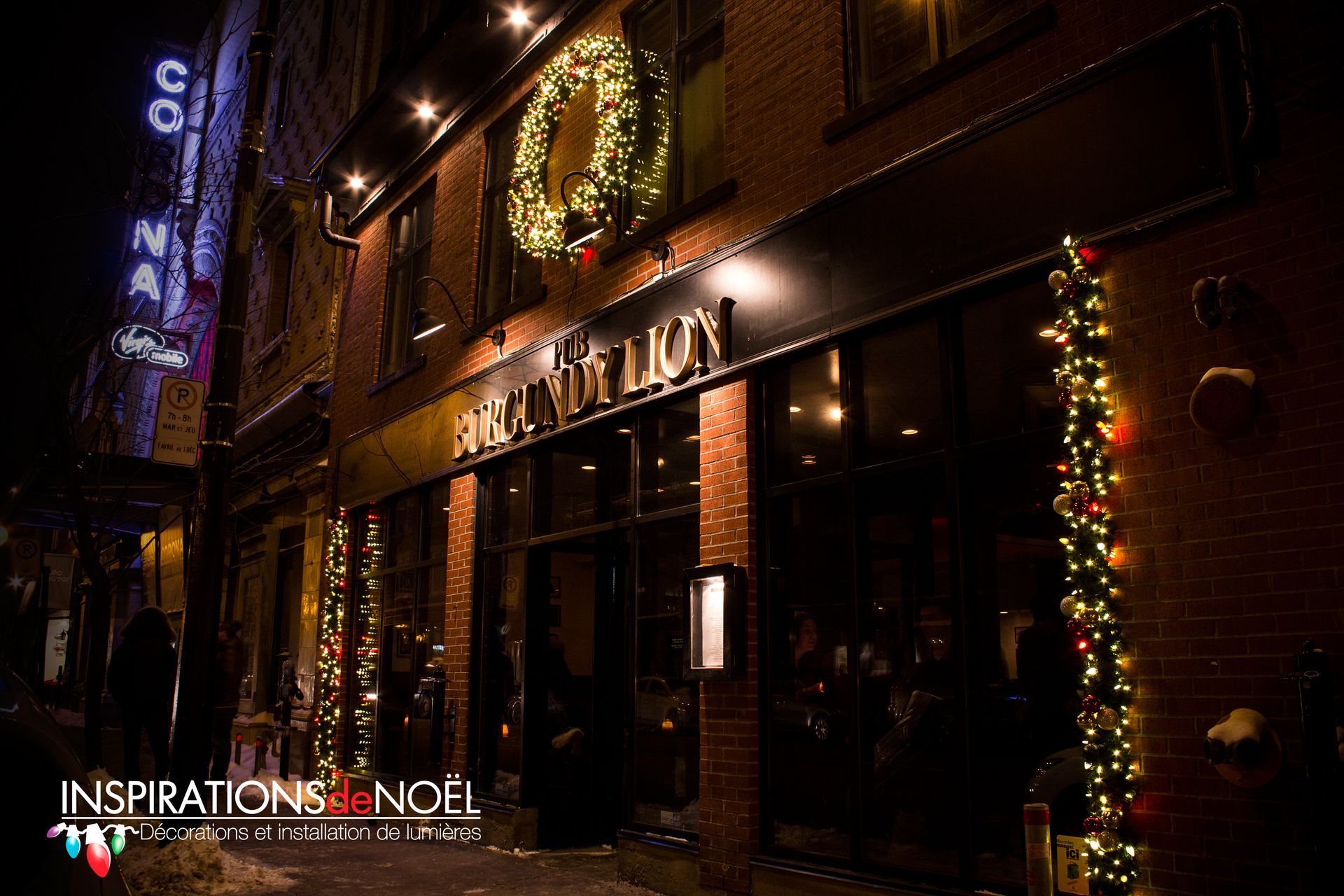 A brick building with a sign that says ' inspirations noel ' on it