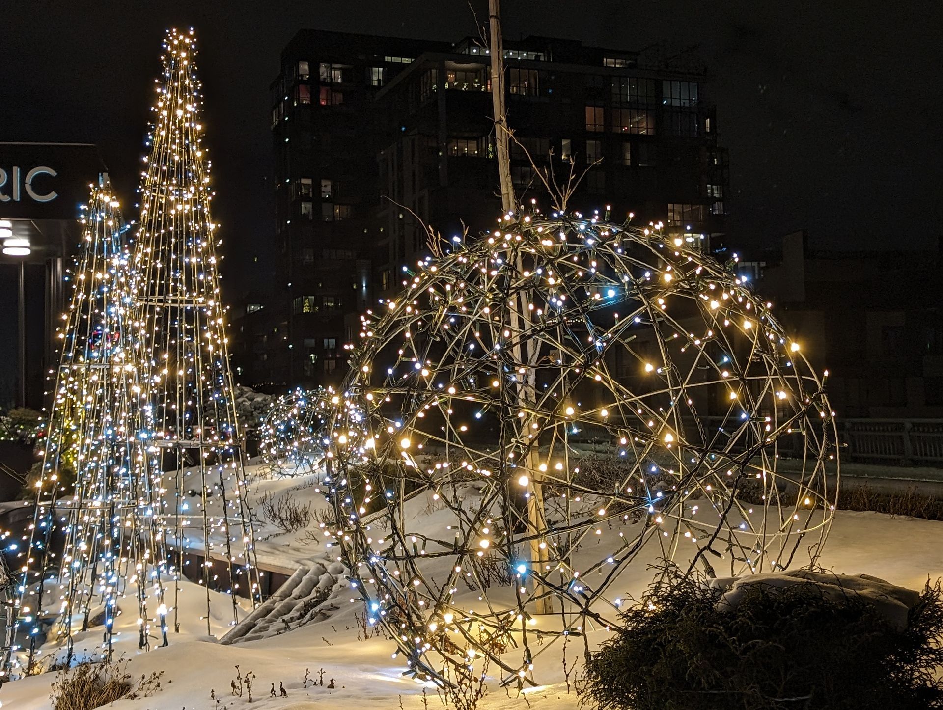 A building with the word ric on it is lit up at night