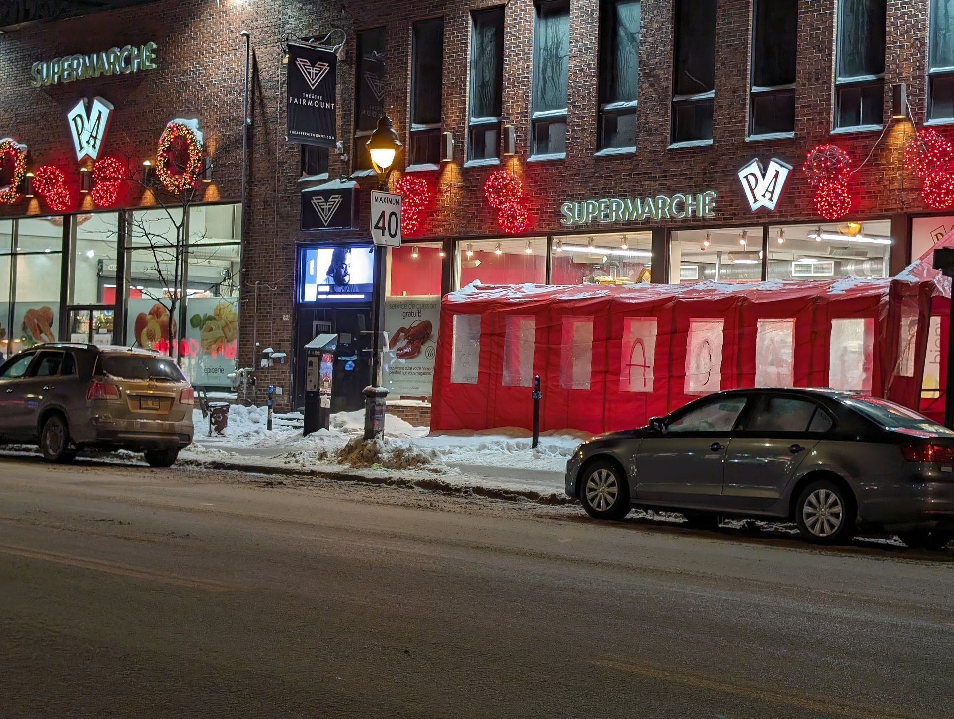 A car is parked in front of a supermarket