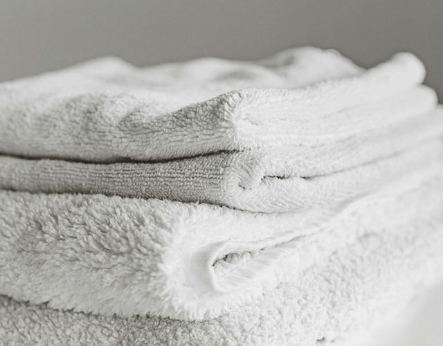 Stack of white fluffy towels.