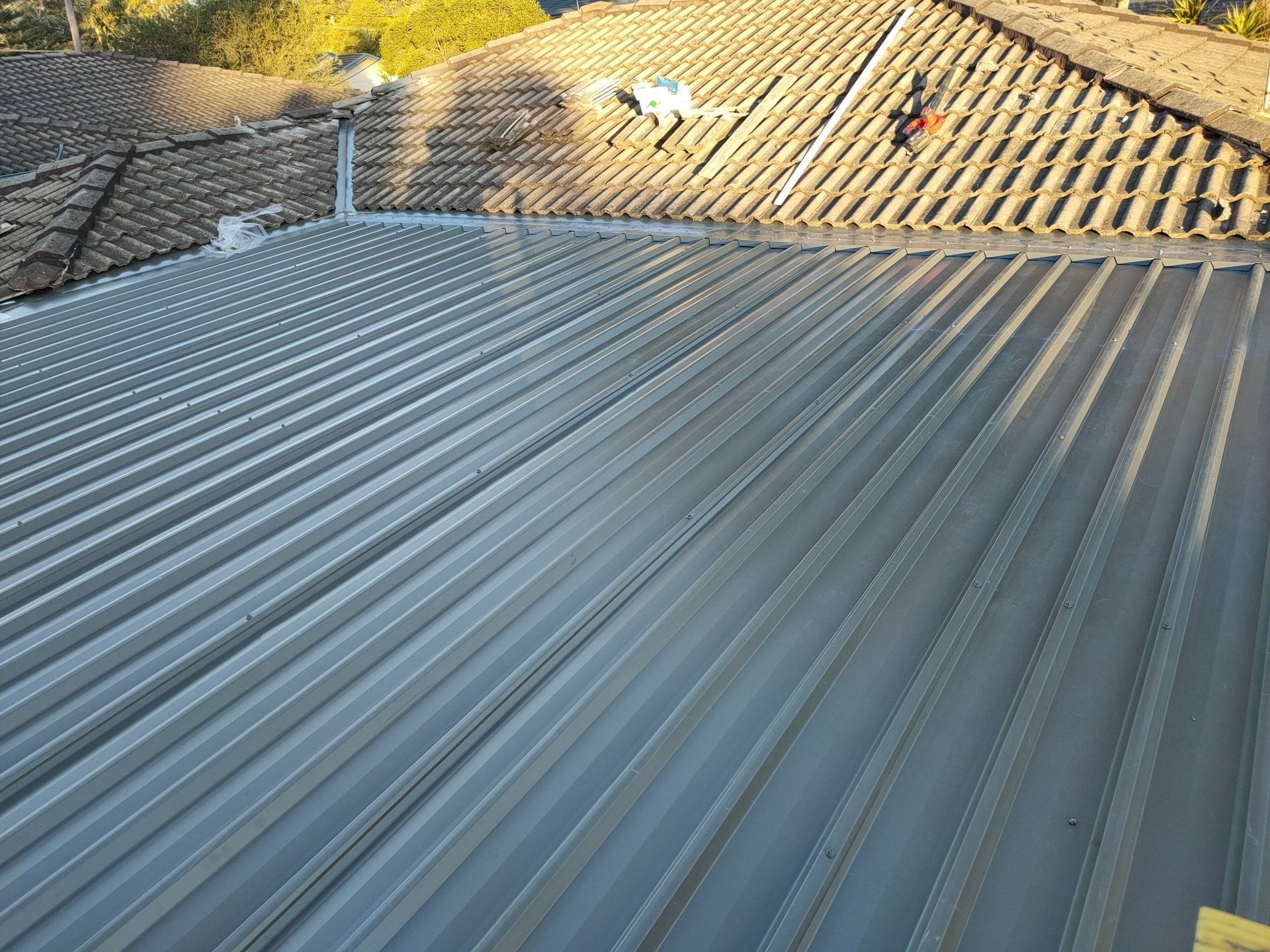 Worker Builder with Hand Drill - Roofing Specialist in Port Stephens, NSW