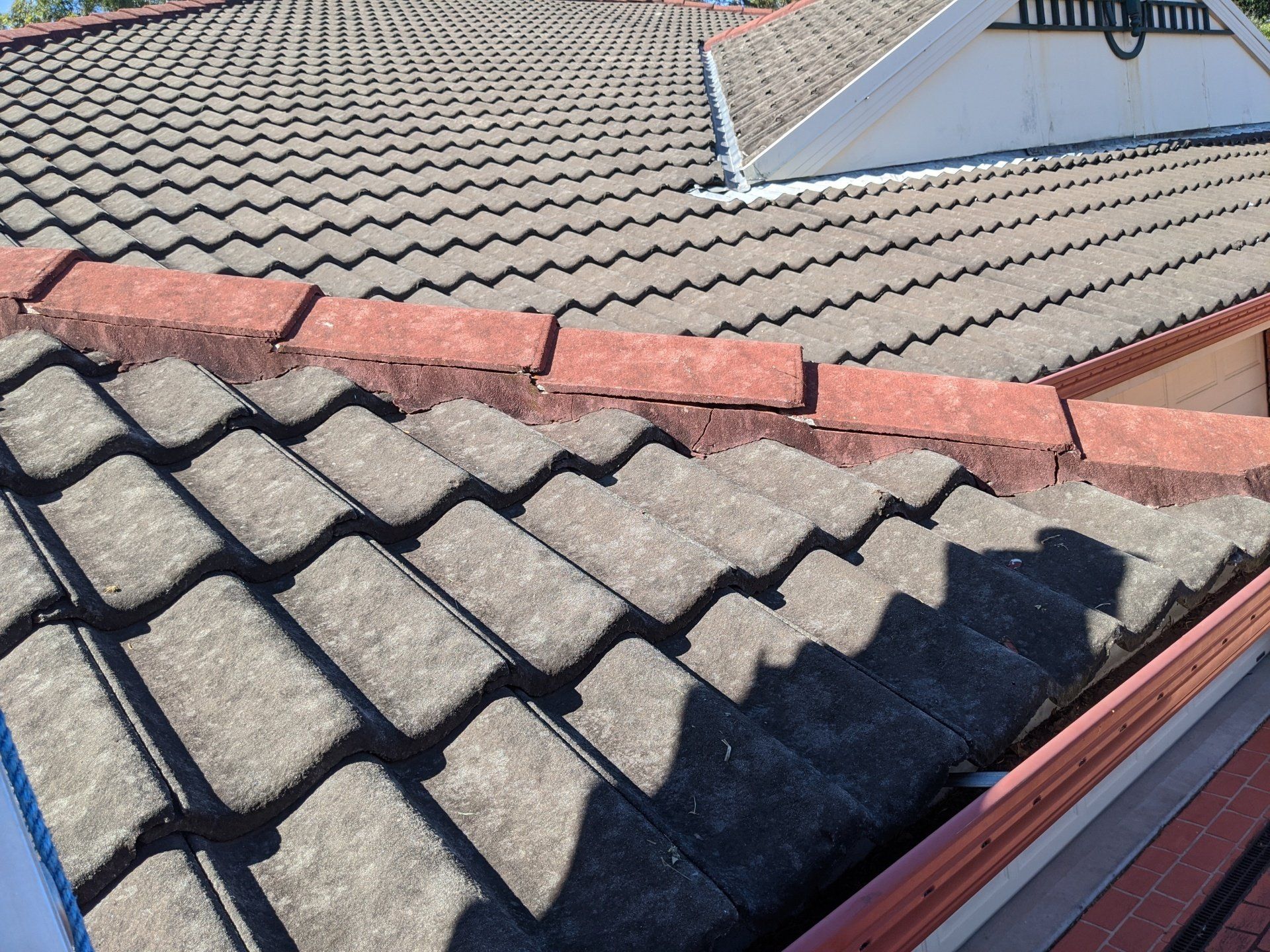 Roof with Black and Red Tiles  - Roofing Specialist in Port Stephens, NSW