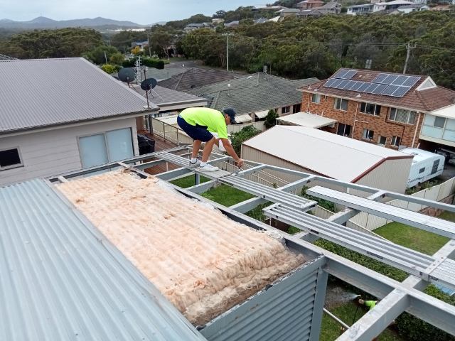 Worker on Roof Doing Repairs - Roofing Specialist in Port Stephens, NSW