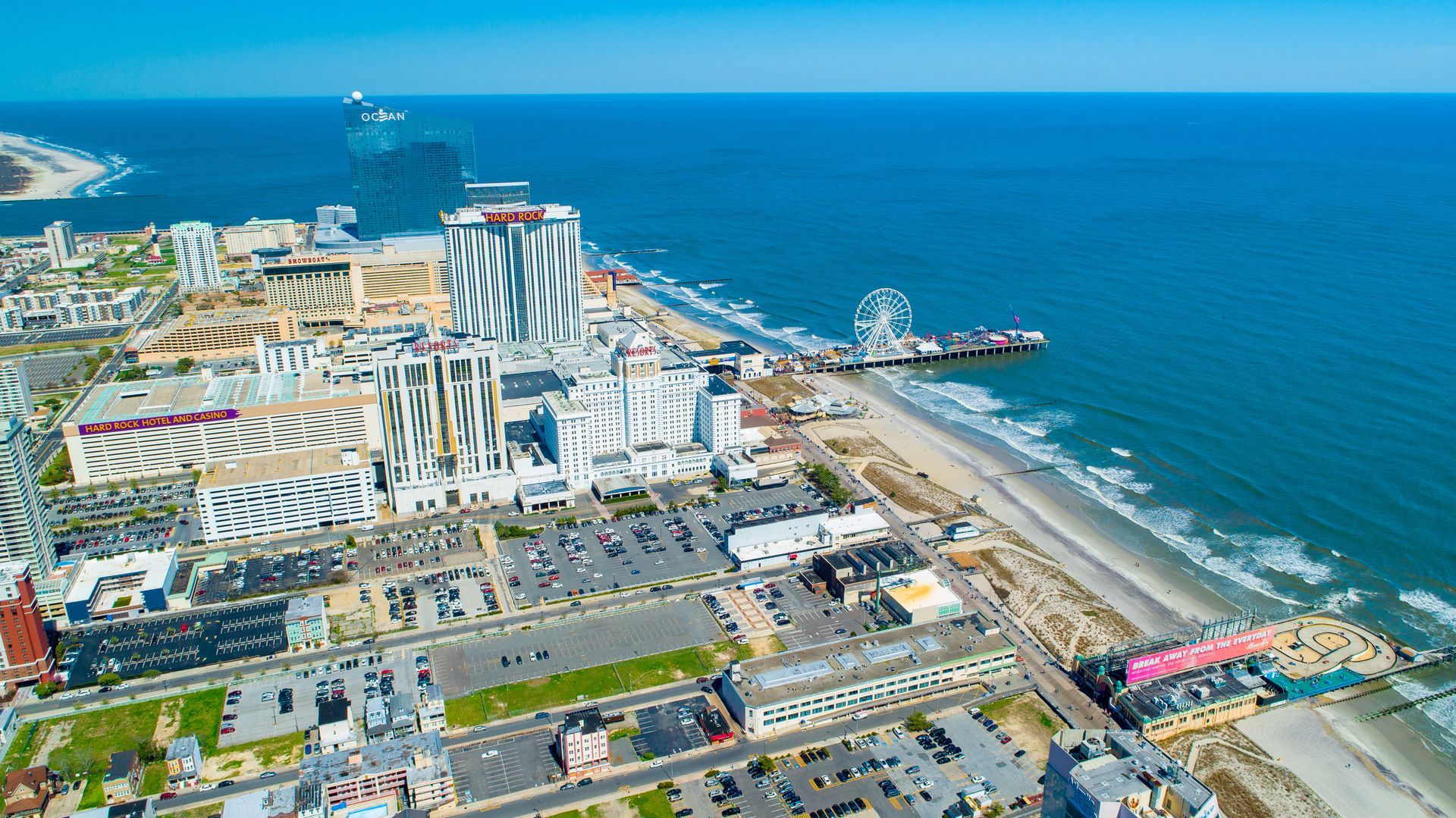 An aerial view of a city next to the ocean.