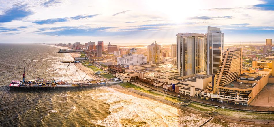 An aerial view of a city with a large body of water in the background.
