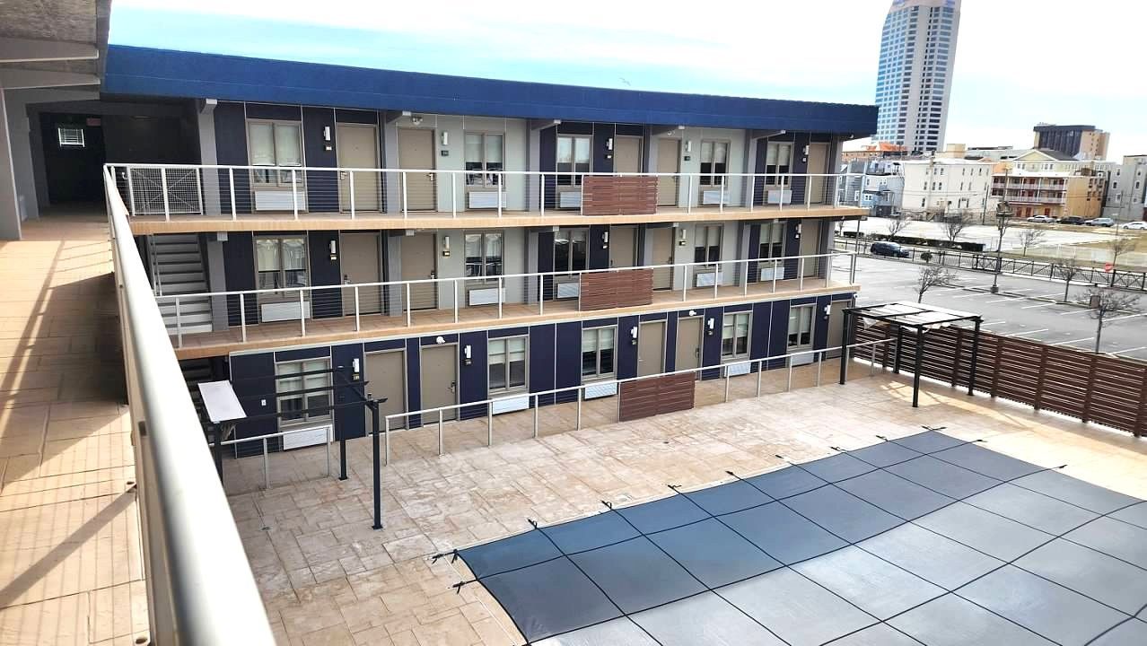 A large building with a lot of windows and balconies