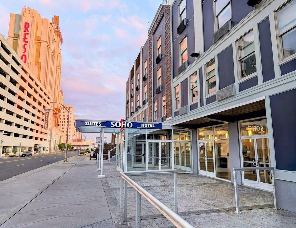 A large building with a sign that says suites on it