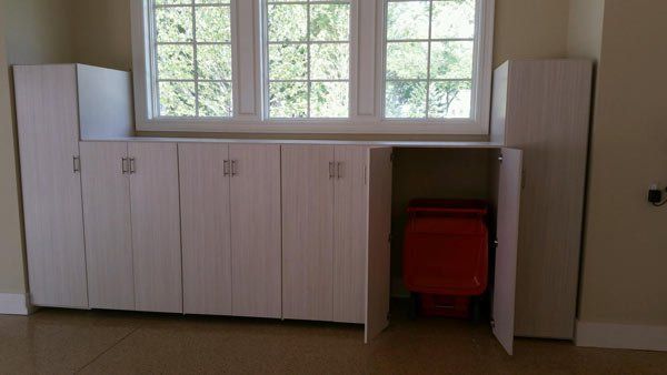 Custom garage cabinet storage unit with door open